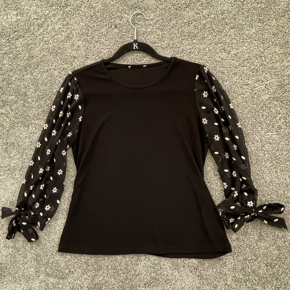 Black blouse with sheer floral sleeves